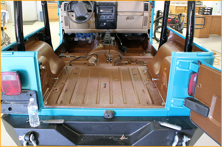 Jeep interior floor and tailgate door lined with GatorHyde and topcoated with a tan aliphatic automotive spray