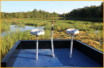 Custom built air boat with 750 HP motor with GatorHyde and color stable paint on deck and seating platform.