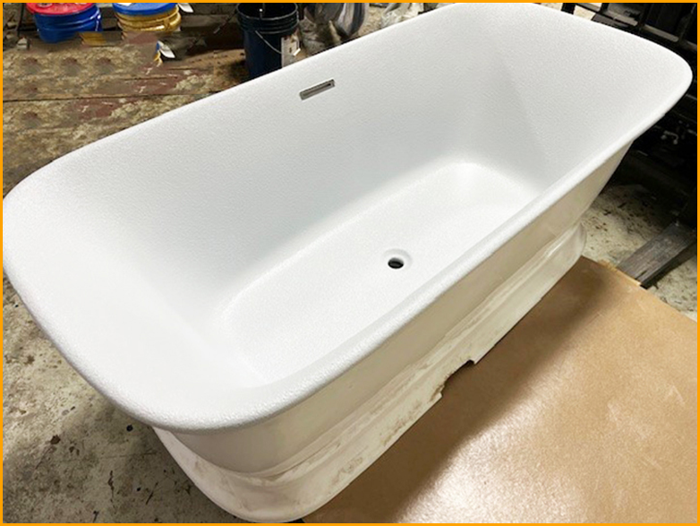 Fiberglass bath tub sprayed with GatorHyde and topcoated with a white aliphatic paint.