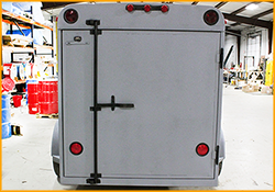  Small cargo trailer with GatorHyde coating and with hardware re-installed.